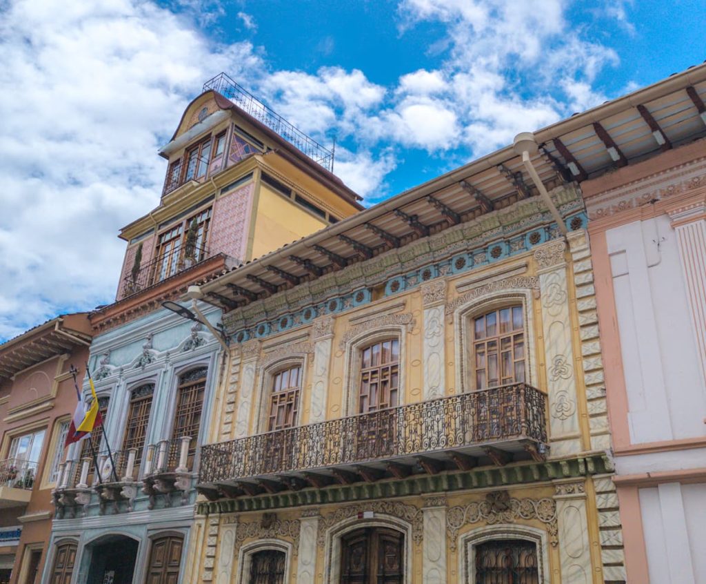 Ornate historic facades of colonial buildings along Avenida Simón Bolívar, one of the best things to see in Cuenca.