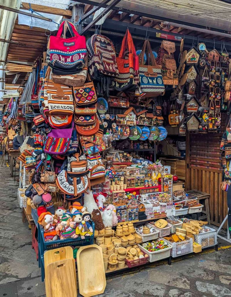 Handmade crafts, leather bags, wooden toys, and souvenirs displayed at one of the artisan market in Cuenca.