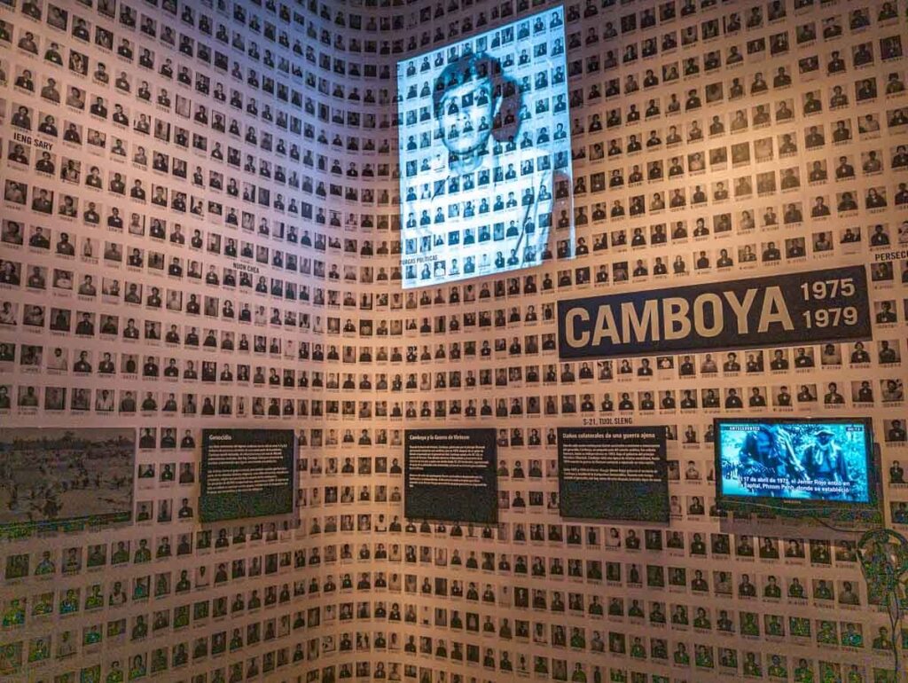 Wall of pictures of people from Cambodia at the Memory and Tolerance Museum in CDMX.