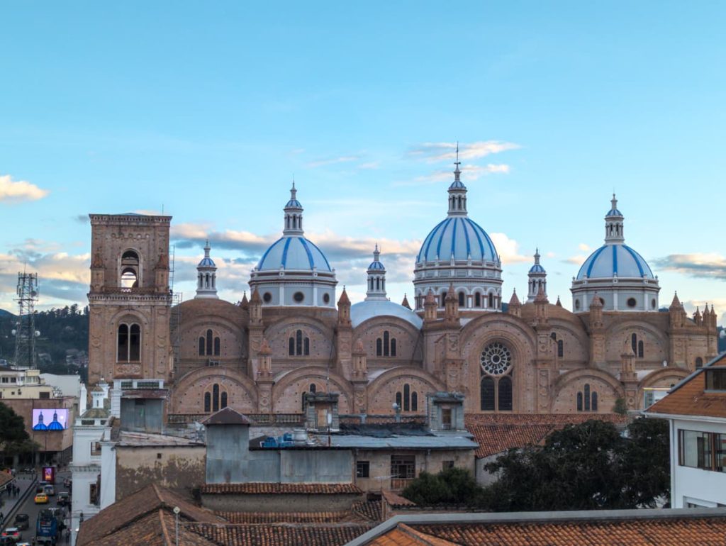 View of the Cathedral's large blue domes around dusk. The cathedral is one of the most iconic things to see in Cuenca Ecuador.