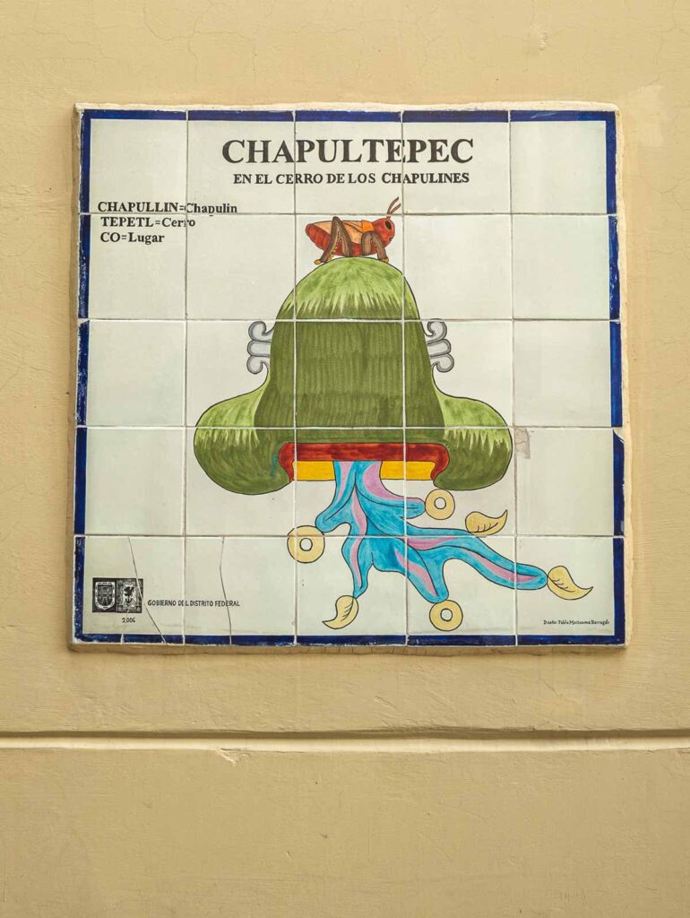 Painted tile depicting the origin of the name of Chapultepec Park Mexico City features a green hill with a grasshopper on top.