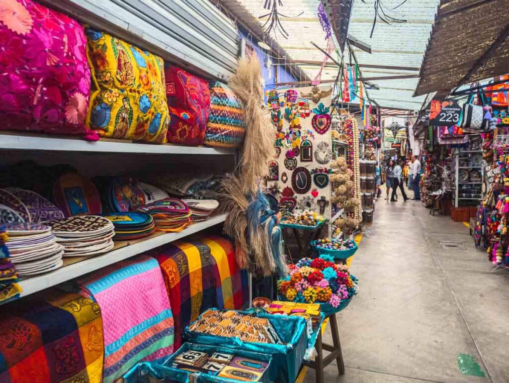 Colorful textiles and other items on display at La Ciudadela artisan market in Mexico City.