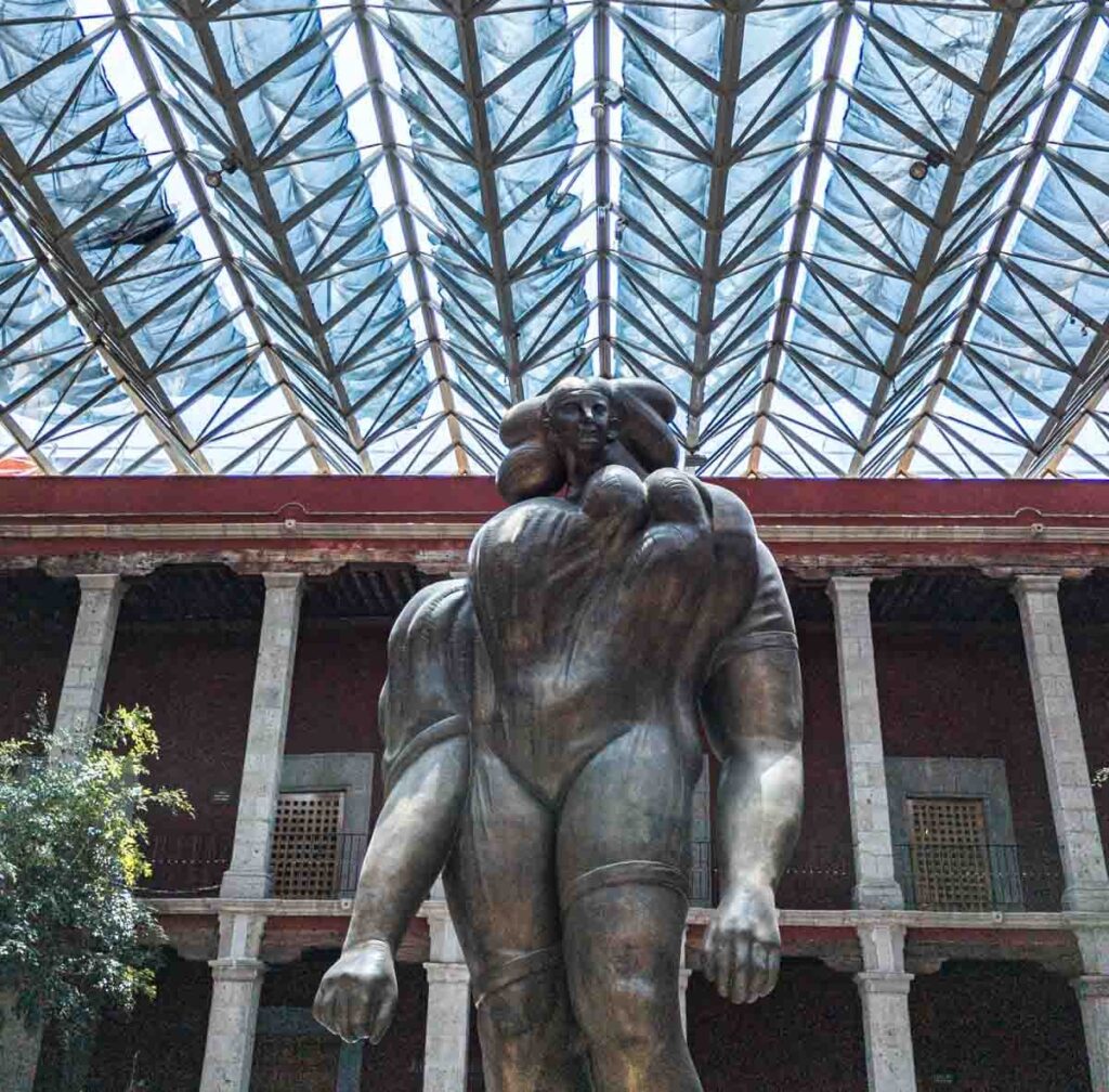 A huge gray metal statue in the courtyard of the Jose Luis Cuevas Museum in Mexico City.
