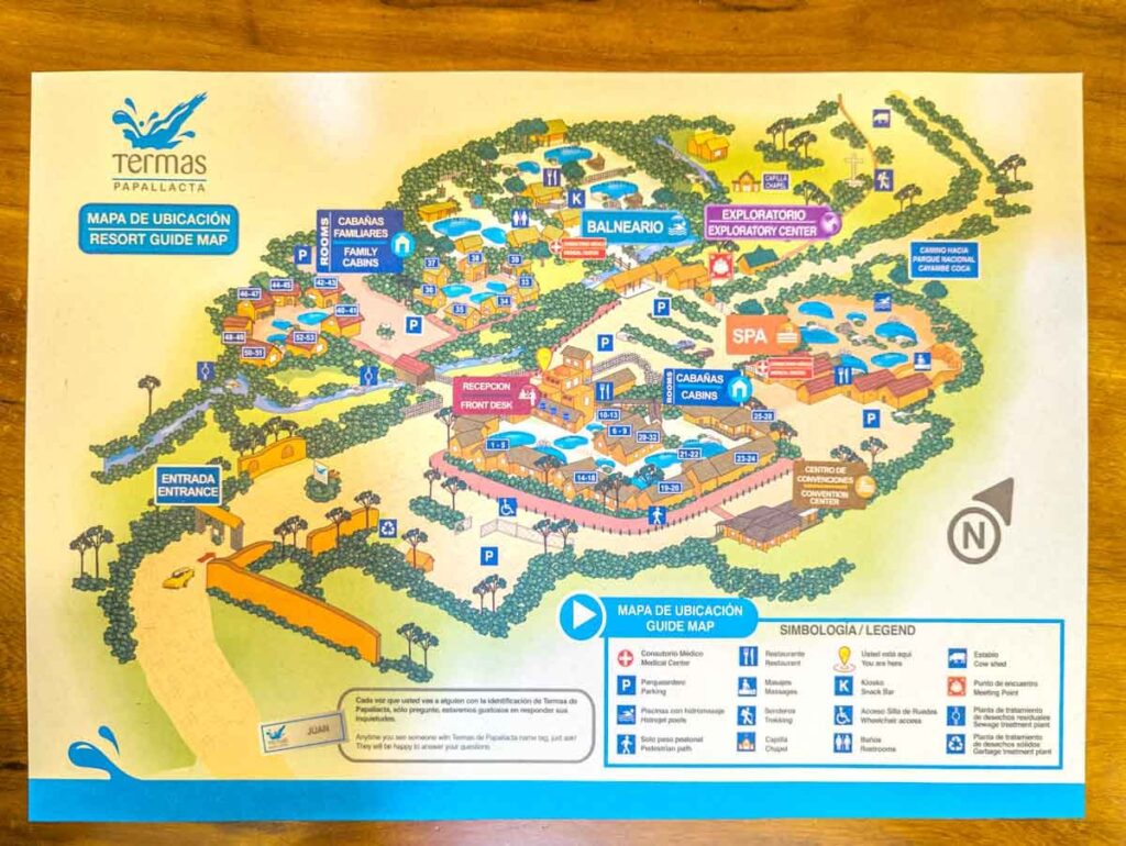 A map of Papallacta hotel resort near Quito shows the reception area, cabins, hot springs, and hiking trails.