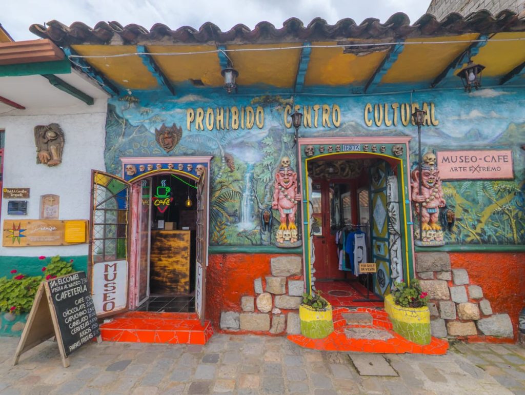 Colorful entrance to the Prohibido Centro Cultural in Cuenca, a museum-café known for its bold artwork and alternative art displays.