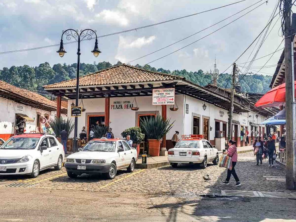 A sunny day in Santa Clara del Cobre Michoacan with people wandering on the streets.