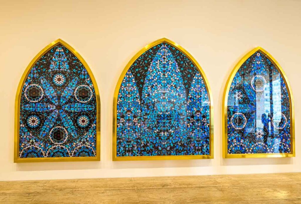 Black and blue stained glass wall art made of butterflies at the Jumex Museum in Mexico City.