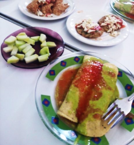 Typical food of a Mexican cantina - botanas or snacks of enchiladas and cucumber.
